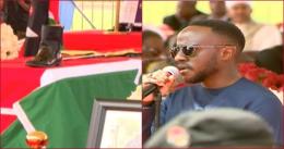 The late Francis Ogolla's son Joel Rabuku (r) during the military honours for his late father.